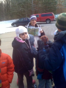 Adams showing the kids a picture before heading off to the trail