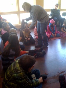 Adams showing the children the two types of beaver fur